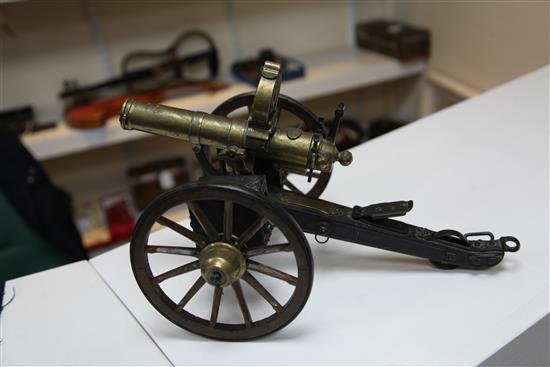 A brass and painted steel working model of an 1883 gatling gun, 14in.